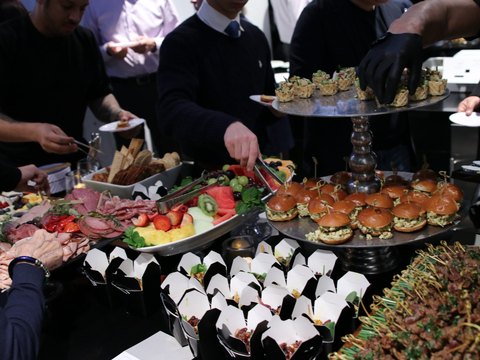 Guests serving themselves at a reception after a concert